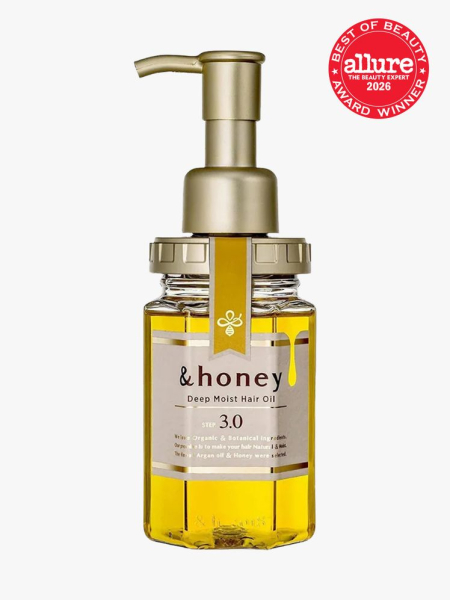 &Honey Deep Moist Hair Oil clear jar of yellow hair oil with gold pump cap on light gray background with red Allure Best of Beauty seal in the top right corner