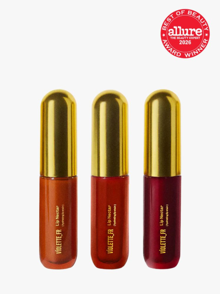 Violette_FR Lip Nectar three vials of lip stain with gold caps on light gray background with red Allure Best of Beauty seal in the top right corner