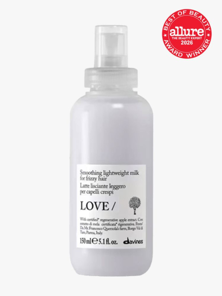 Davines Love Smoothing Lightweight Milk in branded bottle component on a light gray background with the 2026 best of beauty seal in the top right corner