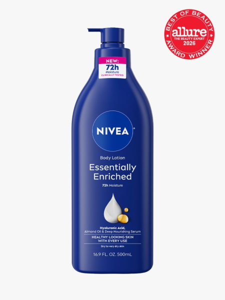 Blue pump bottle of Nivea Essentially Enriched Body Lotion with Allure Best of Beauty stamp in the top right corner on a light gray background